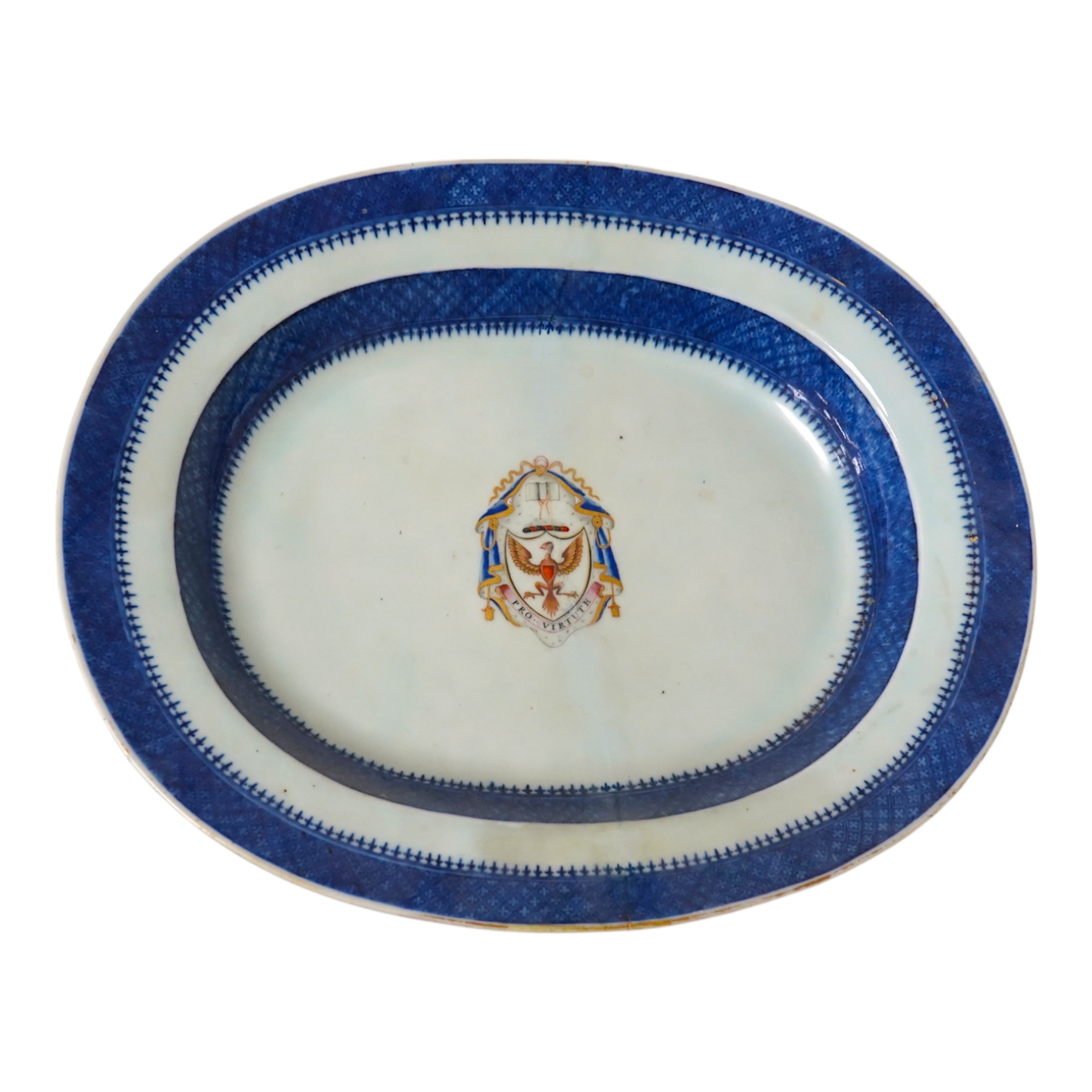 A late 18th century Chinese export armorial oval dish with Pro Virtute armorial, 37cm. Condition - restored